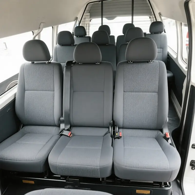 Auckland Airport Van Transfer 5 Toyota Hiace 12-seater van - real photos you provided. Left: High-roof cabin interior with 11 grey passenger seats. Right: Massive open boot at Auckland Airport Terminal 3 loaded with 10+ suitcases, golf bags (Callaway & Titleist), stroller and luggage.